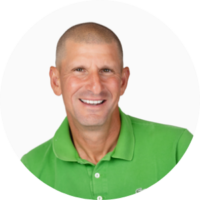 Headshot of a smiling person wearing a bright green collared shirt against a white background.